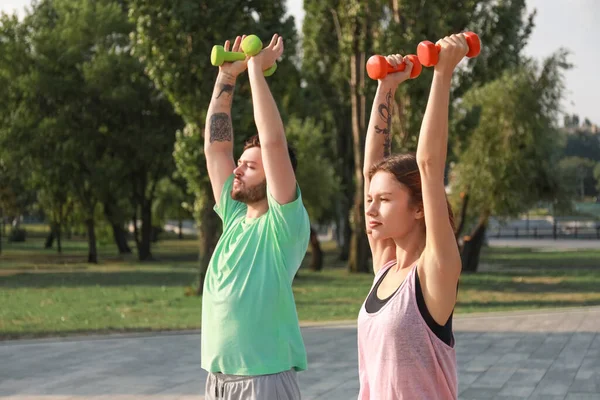Sporty Young Couple Training Dumbbells Outdoors — Stock Photo, Image