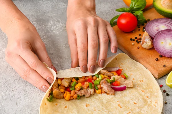 Woman Preparing Tasty Burrito Meat Light Background — Stock Photo, Image