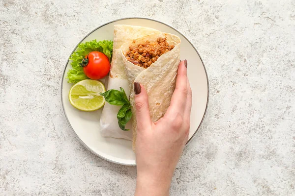 Woman Holding Tasty Burrito Light Background — Stock Photo, Image