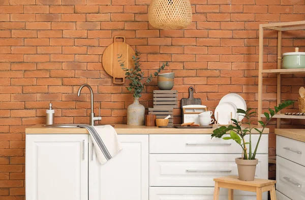 Wooden Counter Sink Different Cookware Brick Wall — Stock Photo, Image