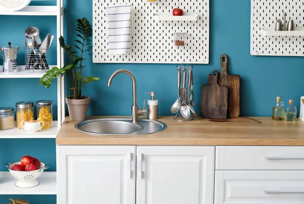 Wooden Counter Silver Sink Pegboards Shelving Unit Blue Wall Kitchen — Stock Photo, Image