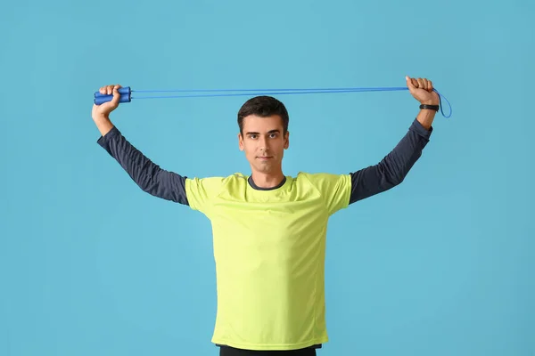 Sporty Young Man Jumping Rope Color Background — Stock Photo, Image