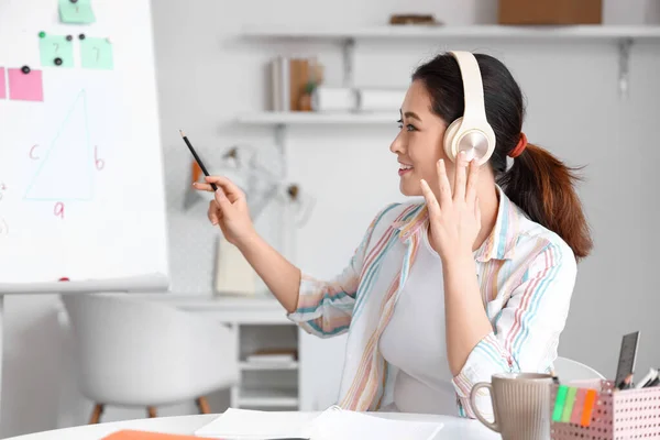 Young Asian Tutor Headphones Giving Math Lesson Home — Stock Photo, Image