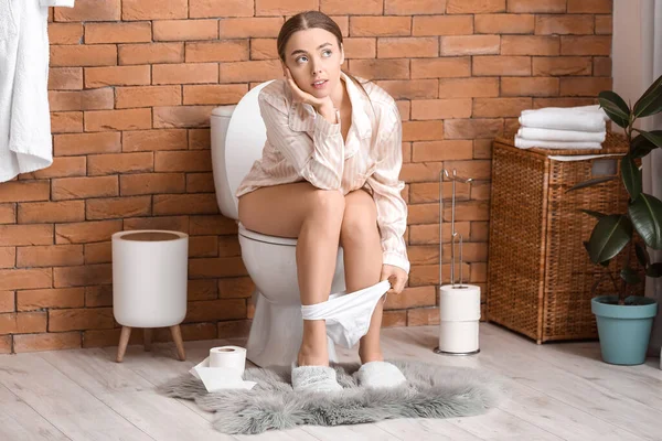Young Woman Pajamas Sitting Toilet Bowl Bathroom — Stock Photo, Image