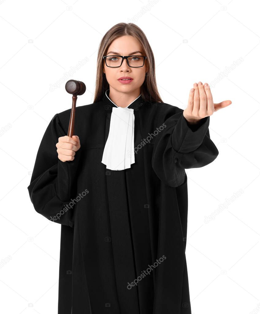 Young female judge with gavel showing beckon gesture on white background
