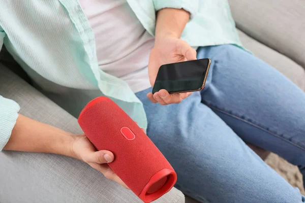 Man Connecting Mobile Phone Modern Wireless Portable Speaker Sofa Closeup — Stock Photo, Image