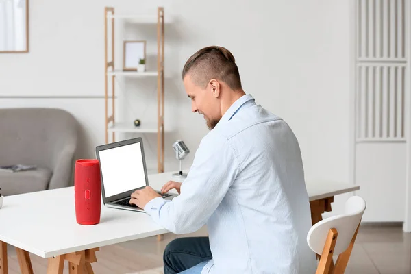 Young Man Using Laptop Table Wireless Portable Speaker Room — Stock Photo, Image