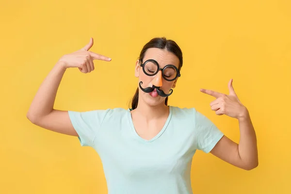 Young Woman Pointing Funny Disguise Yellow Background April Fools Day — Stock Photo, Image