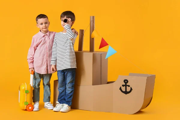 Funny Little Boys Playing Cardboard Ship Yellow Background — Stock Photo, Image