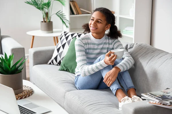 African American Teenage Girl Drinking Tea While Relaxing Sofa Home — Stock Photo, Image