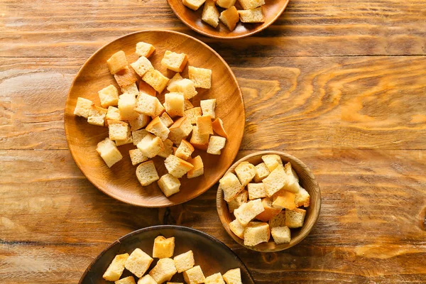 Bowls Tasty Croutons Wooden Background — Stock Photo, Image