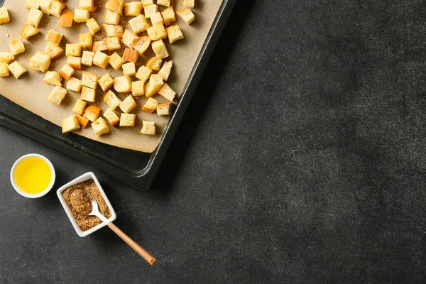 Baking Dish Croutons Oil Spices Black Background — Stock Photo, Image