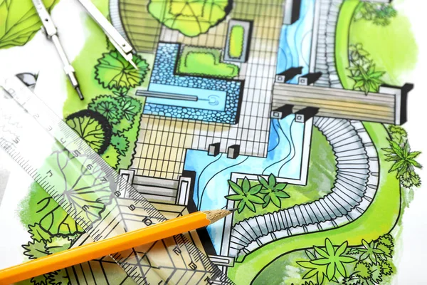 Landscape designer\'s plan with stationery, closeup view
