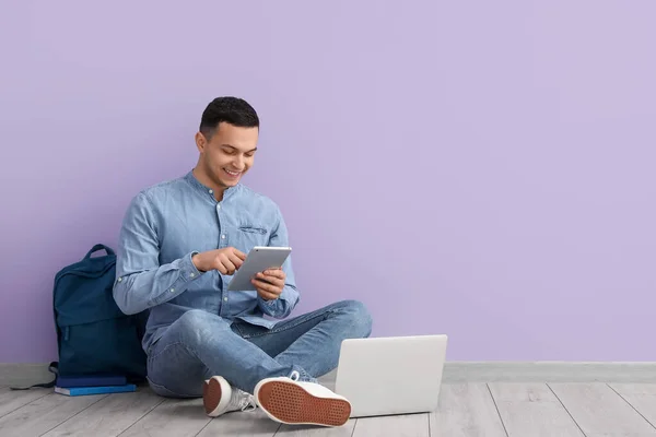 Male Student Using Tablet Computer Lilac Wall — Stock Photo, Image