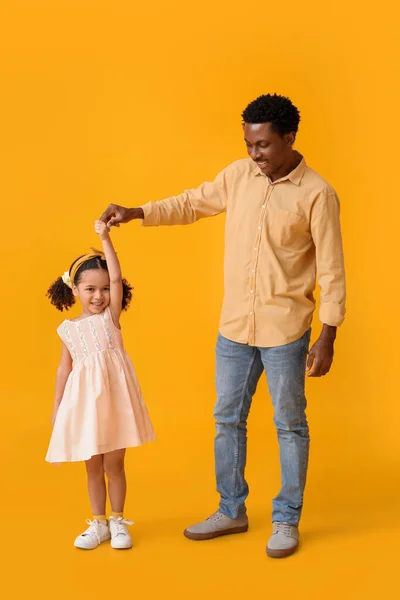Little African American Girl Her Father Dancing Yellow Background — Stock Photo, Image