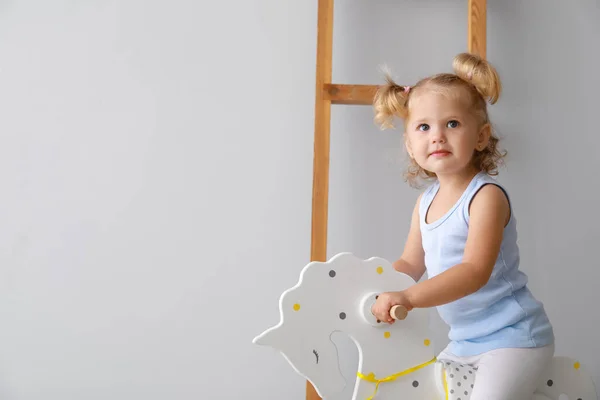 Adorable Baby Girl Rocking Horse Light Background — Stock Photo, Image