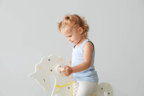 Adorable Baby Girl Rocking Horse Light Background — Stock Photo, Image