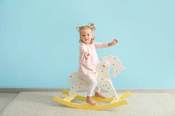 Adorable Baby Girl Rocking Horse Blue Wall — Stock Photo, Image