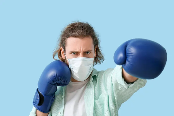 Young Man Wearing Medical Mask Boxing Gloves Color Background Concept — Stock Photo, Image