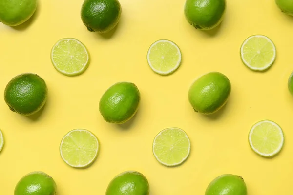 Composition Whole Cut Limes Yellow Background — Stock Photo, Image