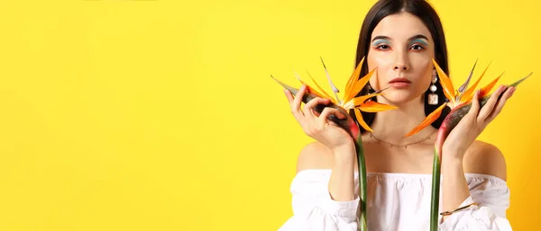 Pretty Young Woman Holding Strelitzia Flowers Yellow Background Space Text — Stock Photo, Image