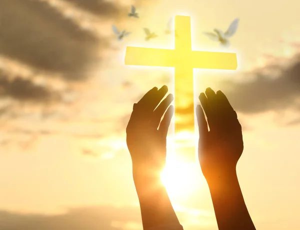 Silhouette Human Hands Glowing Cross Cloudy Sky — Stock Photo, Image