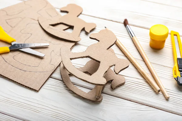 Cardboard Rocking Horse Materials White Wooden Background Closeup — Stock Photo, Image