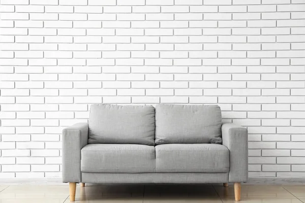 Grey Sofa White Brick Wall — ストック写真