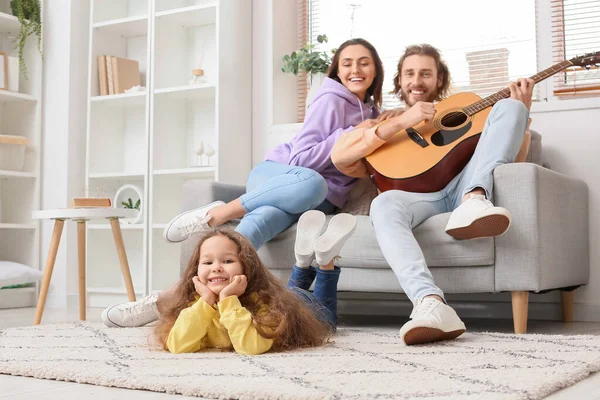 Happy Young Family Playing Guitar Home — Stock Photo, Image