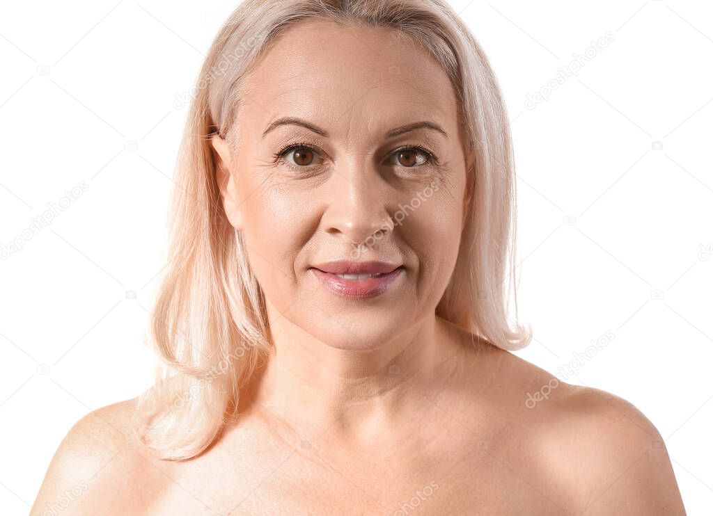 Mature blonde woman with healthy skin on white background, closeup