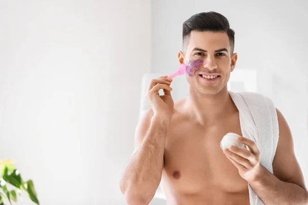 Handsome Man Applying Glitter Mask Bathroom — Stock Photo, Image