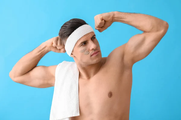 Handsome Man Clay Mask Showing Muscles Blue Background — Stock Photo, Image