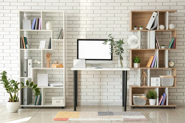 Workplace Computer Plant Branches Vase Shelving Units White Brick Wall — Stock Photo, Image