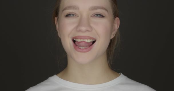Happy Young Woman Brushing Teeth Dark Background — Stock Video
