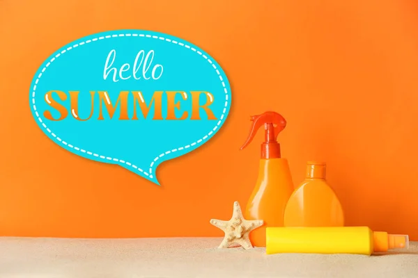 Bottles Sunscreen Sand Orange Background Hello Summer — ストック写真