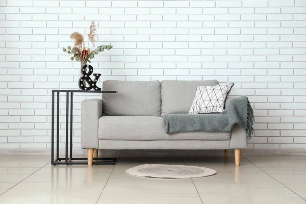 Modern Sofa Pillow Plaid Table Light Brick Wall Room — Stock Photo, Image