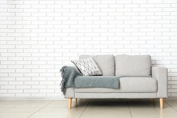 Modern Sofa Pillow Plaid Light Brick Wall Room — Stock Photo, Image