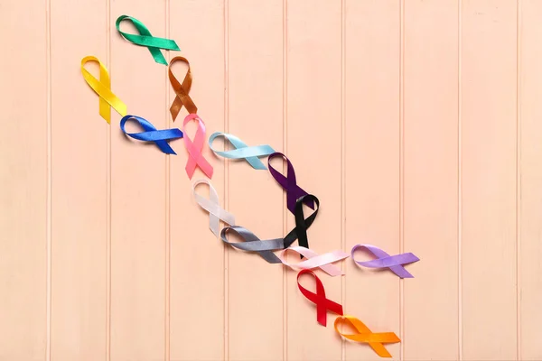 Set Different Awareness Ribbons Color Wooden Background World Cancer Day — Stock Photo, Image