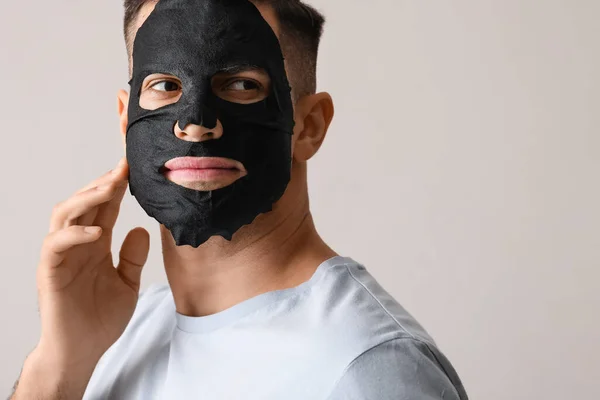 Handsome Man Black Facial Mask Grey Background Closeup — Stock Photo, Image