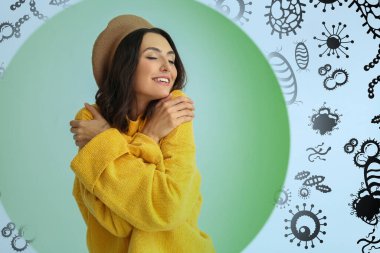 Renkli arka planda güçlü bağışıklığı olan güzel bir genç kadın. Mikroplara, bakterilere ve virüslere karşı koruma