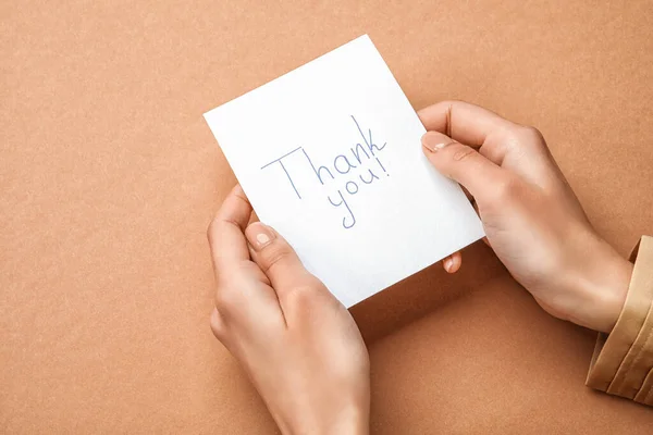 Female Hands Holding Sheet Paper Text Thank You Color Background — Stock Photo, Image
