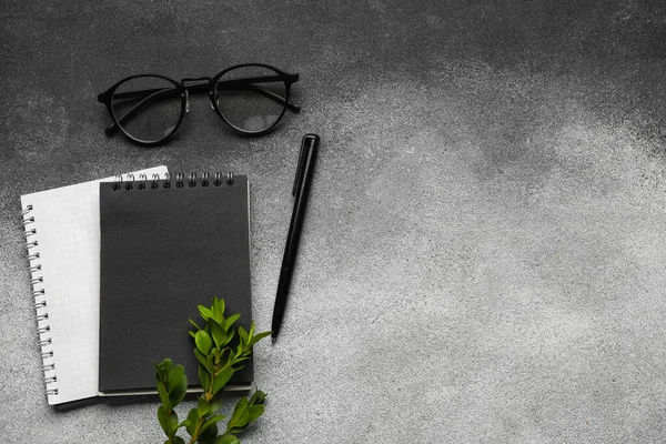 Notebooks Glasses Pen Grey Background Top View — Stock Photo, Image
