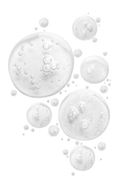 Beyaz arkaplanda kozmetik serumu damlaları