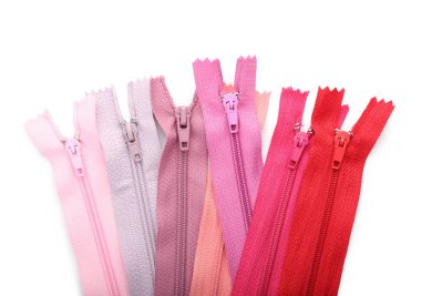 Stylish different zippers on white background