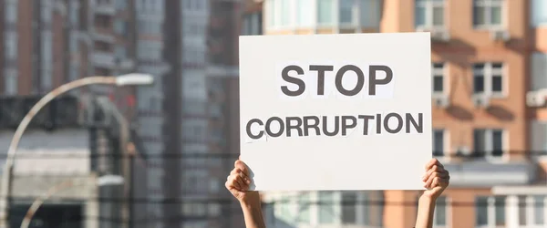 Woman Holding Placard Text Stop Corruption Outdoors — Stock Photo, Image