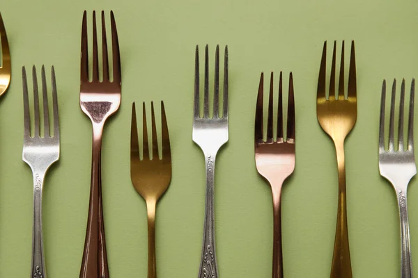 Many Different Forks Green Background Top View — Stock Photo, Image