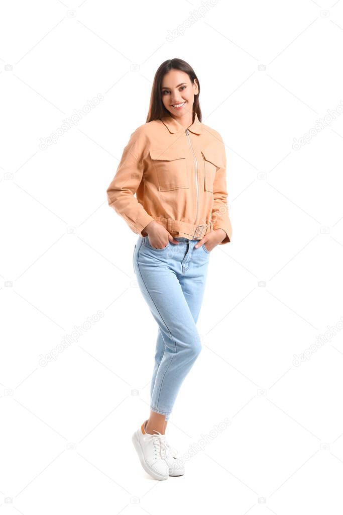 Pretty young woman in stylish clothes on white background