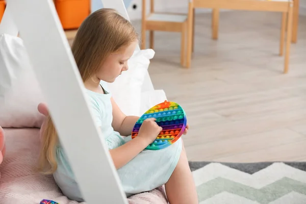 Girl Sitting Bed Playing Pop Fidget Toy Child Room — Stock Photo, Image