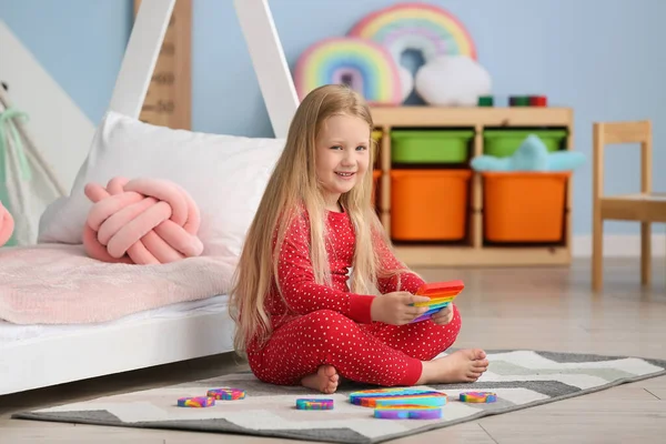 Pretty Girl Sitting Floor Bed Holding Pop Fidget Toy Child — Photo