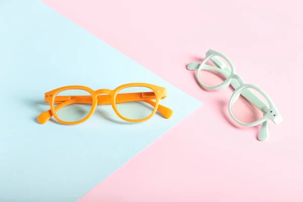 Different Plastic Eyeglasses Color Background — Stock Photo, Image